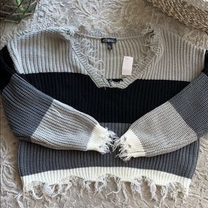 Brand new black, grey and white sweater